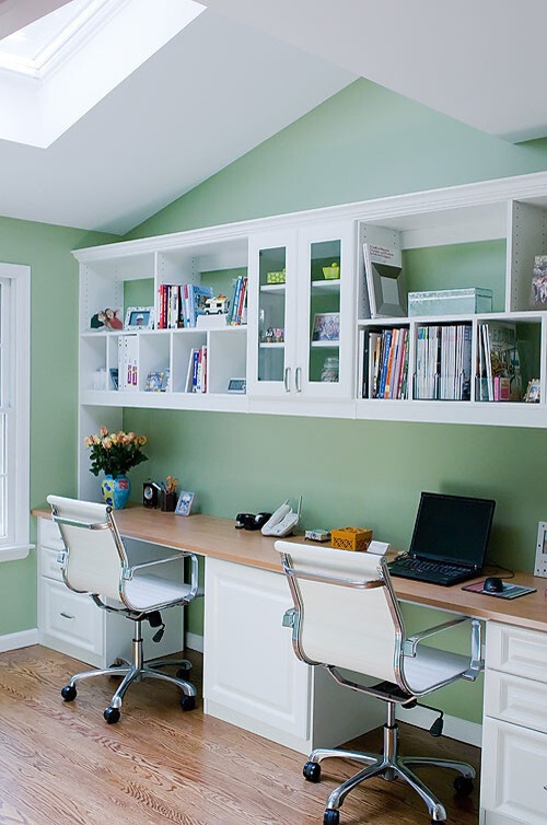 Cabinets on floor with long board for desk top