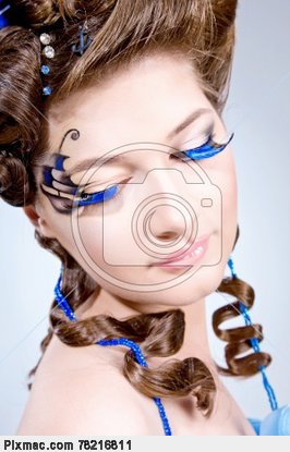 Woman with fashion hairstyle and bright stylish make-up