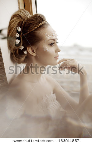 Stylish woman with creative make-up of pearls - stock photo