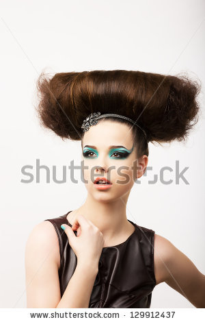 Glamour. Vitality. Portrait of Unusual Brunette with Extraordinary Festive Hair-do - stock photo