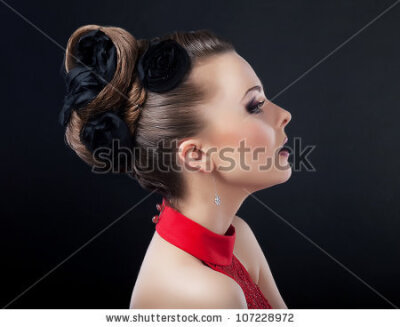 Beautiful young woman face with creative plait hairstyle looking - stock photo