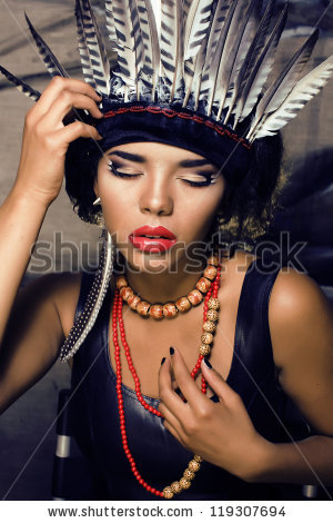 young pretty woman with make up like red indian - stock photo