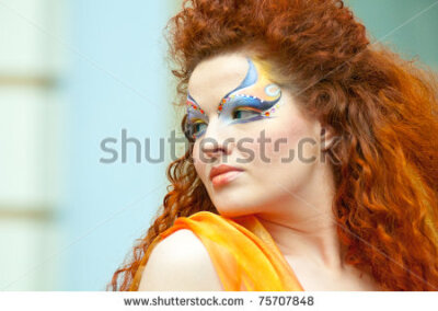 MOSCOW, RUSSIA - FEBRUARY 12: Model prepares backstage during the VIII Open Championship for creative makeup KOSMETIK international on February 12, 2011 in Moscow, Russia. theme "The Sound of Music" -…