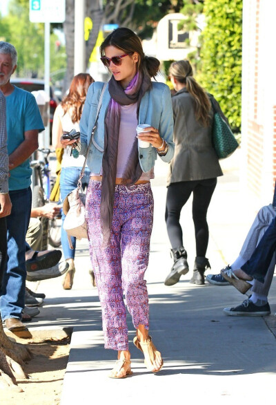 Alessandra Ambrosio wears purple print pants as she grabs a coffee to go from Caffe Luxxe in Santa Monica.