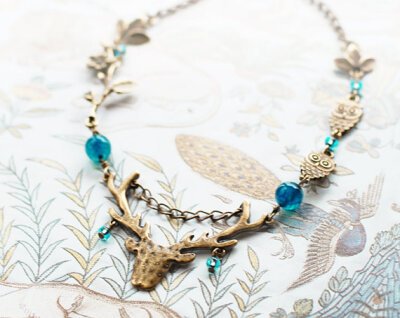 Boho necklace with a deer, owl and Turquoise Blue Deep beads