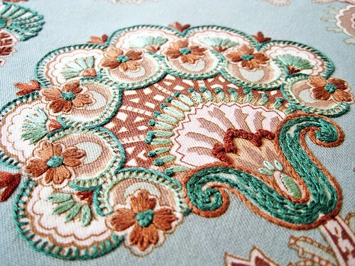 Embroidery over fabric print...by catnipstudio Teal Paisley Hand Embroidery, via Flickr.