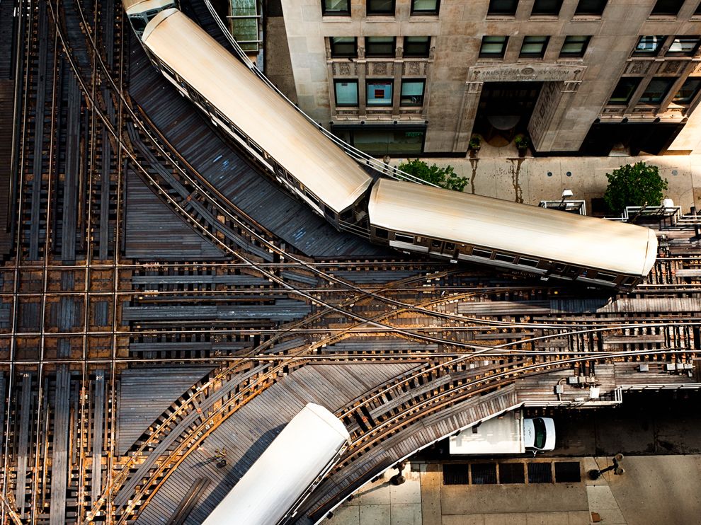 It's a snug fit for Chicago's famous "L" tracks, here shot from above by National Geographic Your Shot community member Angie McMonigal. Flanked on two sides by the elevated rail, the art deco Trustees System Service Building, now a condominium, dates to 1930.