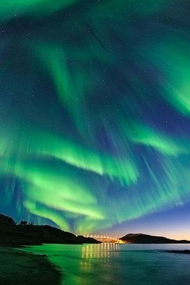 Picture of an aurora borealis, or northern lights, above Norway.