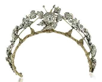 AN ANTIQUE DIAMOND NECKLACE/TIARA Designed as a series of rose-cut diamond leaves to the central floral spray, closed back setting, mounted in silver and gold, converts to form a necklace, mid-19th century, as necklace 37.0 cm long. CHRISTIES