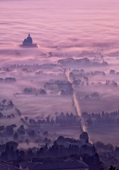 #Assisi, foggy dusk, Italy by Maurizio Rellini http://VIPsAccess.com/luxury-hotels-rome.html