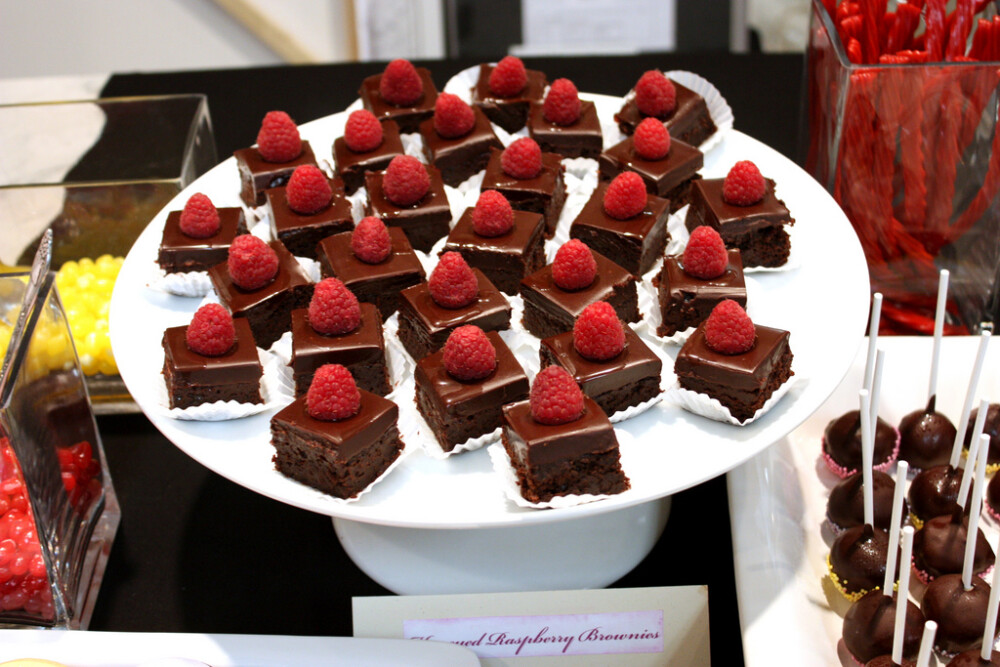 Honeyed Raspberry Brownies from Dessert Bar super fudgy brownies, topped with seedless raspberry preserves, raspberry ganache (spiked with Chambord) and topped with a honey filled raspberry...SO DANG GOOD!!!