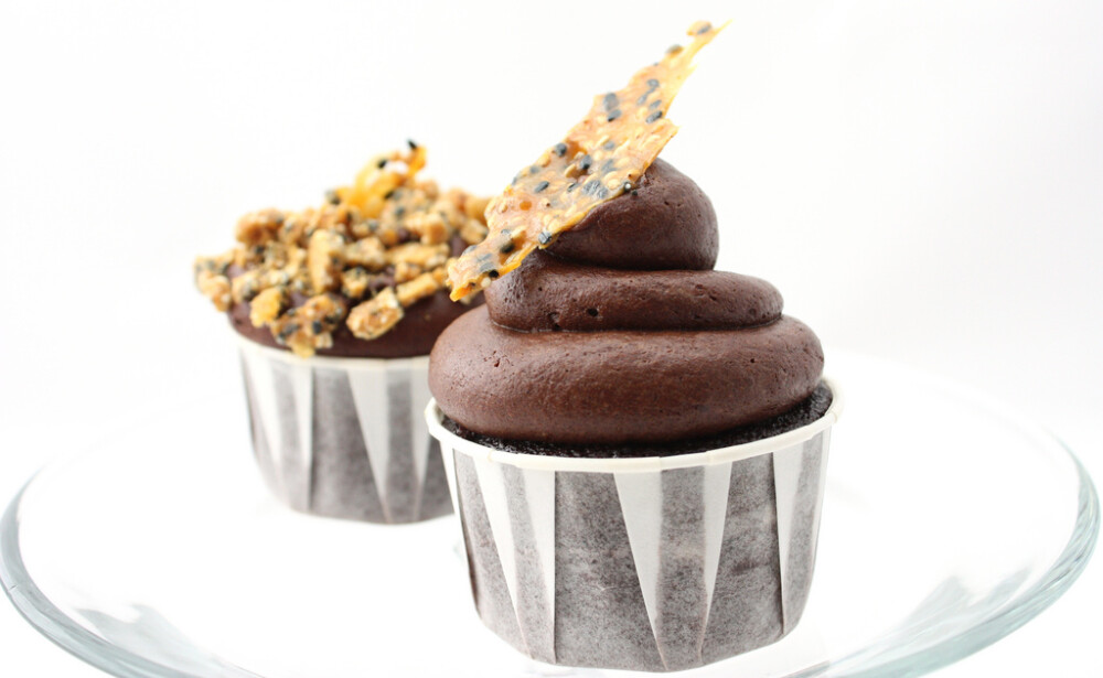 Sesame Wasabi Cupcake for Iron Cupcake Earth Challenge Nuts and Seeds A deep Dark Chocolate Sesame cupcake, filled with wasabi ganache freckled with ginger sesame brittle, topped with dark chocolate wasabi buttercream and a thin, crisp piece of ginger sesame brittle...it's deep, rich, just enough h