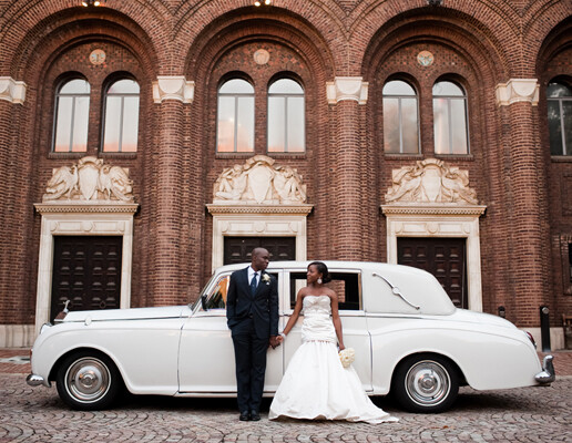 bride and groom in front of vintage car