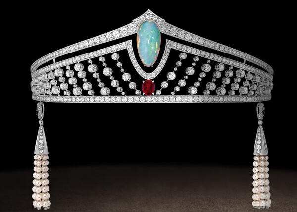 Tiara in platinum, diamonds, set with a twenty-one carat cabochon-cut white opal and a three carat Burmese pigeon’s blood ruby.