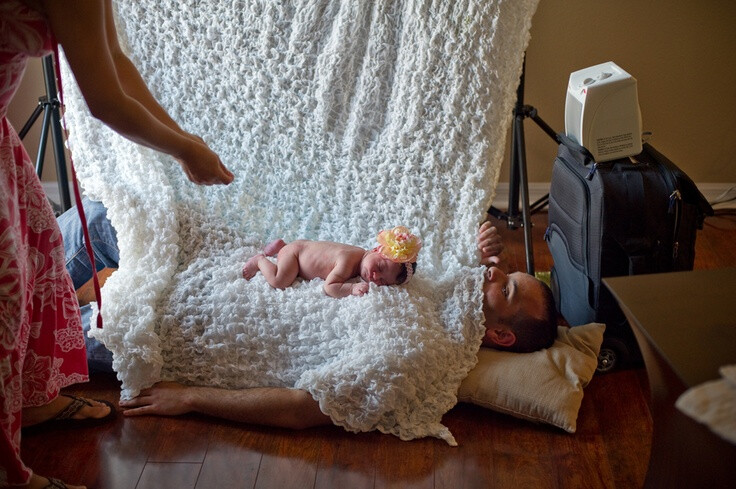 Perfect way to calm a baby during a photo shoot.