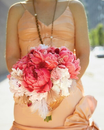 Blush Colored Bouquet This blush-tone bouquet of peonies accented with tea roses and plumes was created by florist Emily Rose Wood. See More of this Wedding in Brooklyn, New York More Wedding Flower Ideas