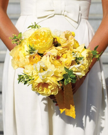 This sunny bouquet -- golden peonies, garden roses, honeysuckle, ranunculus, and poppies -- was designed by bride Joanne's friend and florist Naomi deManana.