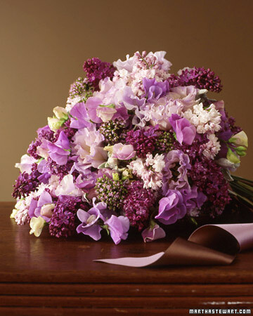 Lush Lilac Bouquet This bridal bouquet is overflowing with fragrance and texture. Ruffly sweet peas and tumbling lilacs, ranging from deep purple to almost pink,suggest romance. Tucked in between are more sweet peas in creamy whites, plus lamb's ear, oregano blossoms, and lisianthus. Two-tone ribbon