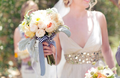 Romantic bridal bouquet tied with striped ribbon