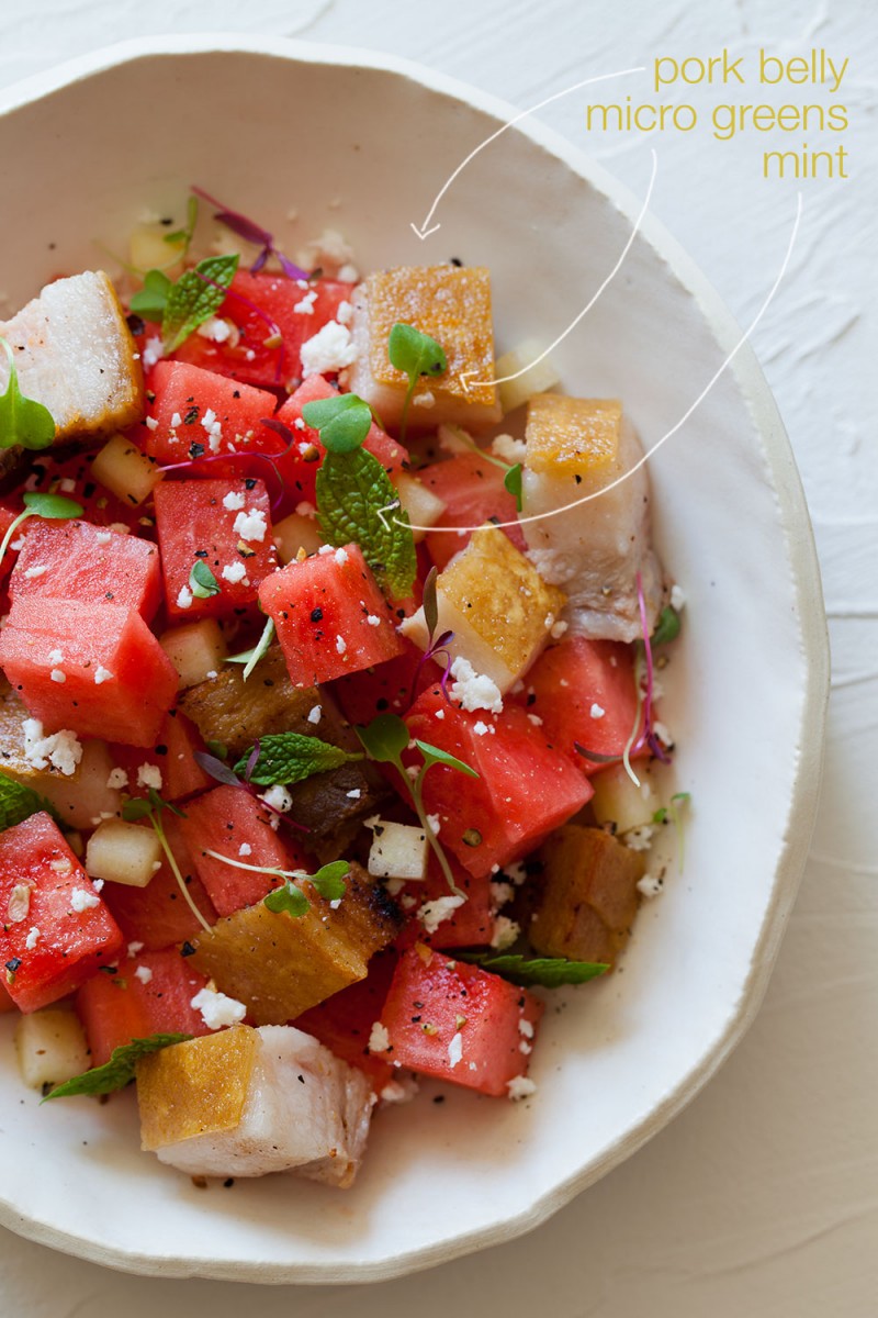 A great summer salad with watermelon, feta, mint, cubes of crispy pork belly, and micro greens.