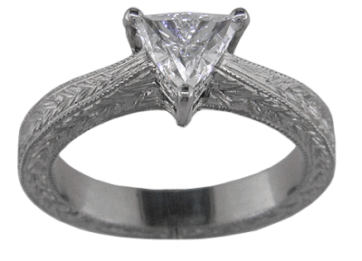 Trilliant diamond platinum hand engraved ring. (J5246)