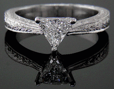 Trilliant diamond platinum hand engraved ring. (J5246)