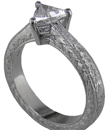 Trilliant diamond platinum hand engraved ring. (J5246)