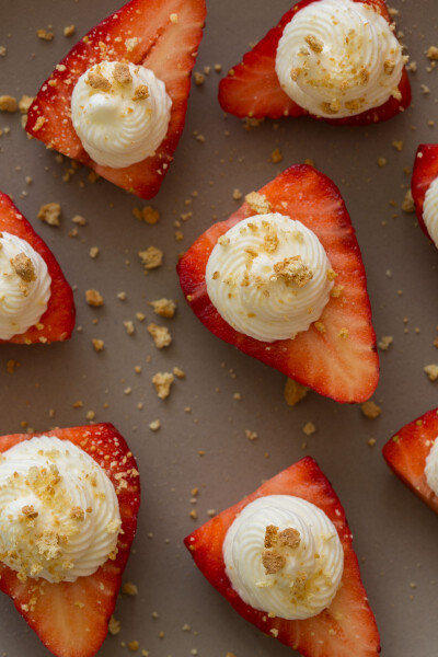 Strawberries stuffed with a cream cheese filling and topped with crumbled graham crackers.