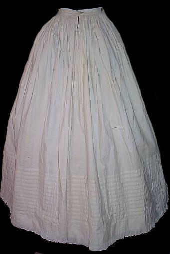 C.1860 -1862. It was considered a faux pas for the ridges of your hoops to show through your skirt. to fix this, women wore full petticoats, as wide as their outer skirts, to go over the crinoline, to soften the edges of the hoops so they wouldn't show through.