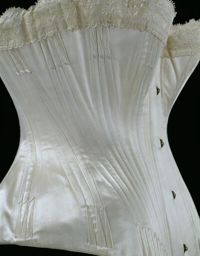 Wedding corset (satin, silk thread flossing and silk braid; lined with coutil) made by Edwin Izod, England, 1887. http://collections.vam.ac.uk/item/O115825/wedding-corset/