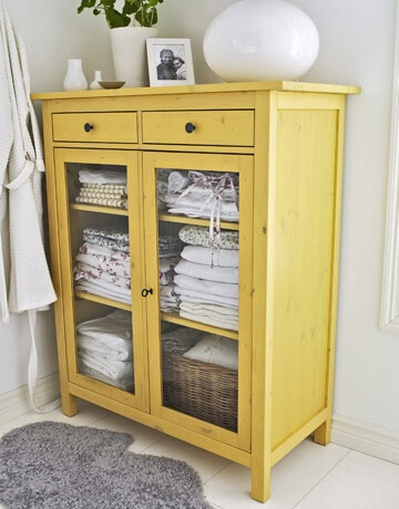 yellow linen cabinet