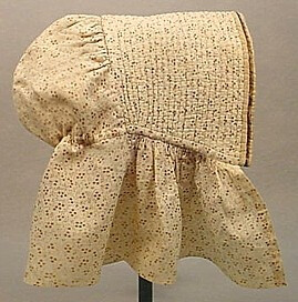 A very sweet original circa 1860 girl's brown on white calico printed cotton bonnet. A fully corded brim bound in silk satin, with tiny cartridge pleated sides to the neck curtain and an inner drawstr…