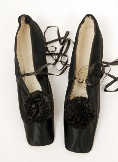 1860 Women's Evening Shoes, Black silk with silk ribbon pompon. Belonged to Empress Eugene