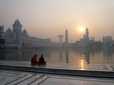 Golden template in India embraced by water