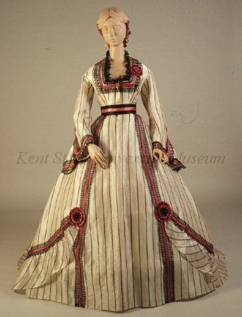 Striped white silk gauze dress (front) with red silk ribbon and black lace trim, and red and black silk sash, American, c. late 1860s.