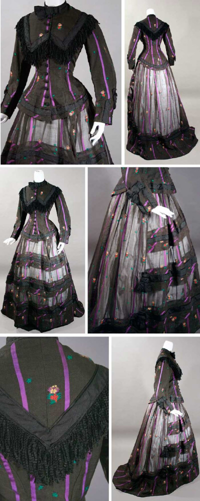 Day dress, mid- to late-1860s. Sheer black fabric, apparently blend of silk &amp; cotton with woven purple satin stripe &amp; floral sprigs in yellow, red, &amp; green. Basque-style bodice trimmed at …