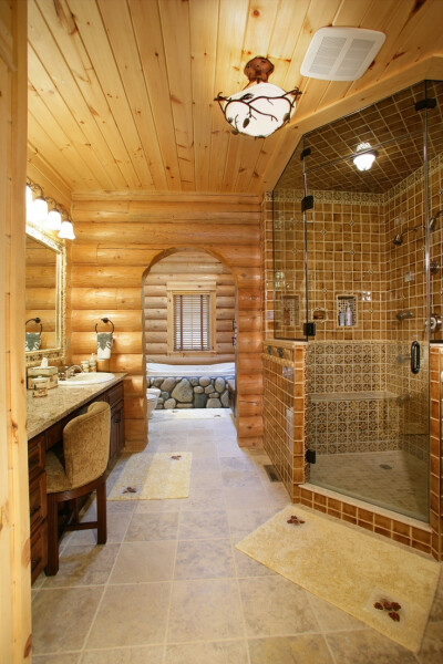 Lovely bathroom in log cabin home.