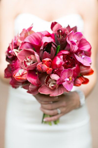 tropical bouquet filled with orchids, peony, calla lily