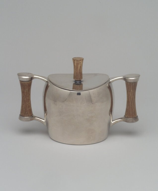 Niagra Falls Silver Co., a Division of Oneida Silversmiths (1877 to present). Sugar Bowl and Lid, from Three Piece Coffee Service, Heirloom Line, ca. 1955. Silverplate, wood, 4 1/4 x 6 1/4 x 3 1/8 in. (10.8 x 15.9 x 7.9 cm). Brooklyn Museum, Gift of Jewel Stern, 2003.11.4a-b. Creative Commons-BY (Ph