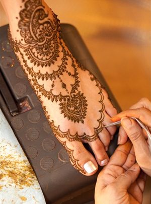 Get a really amazing, beautiful henna tattoo maybe in India