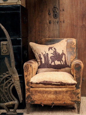 old leather chair | cowboy pillow