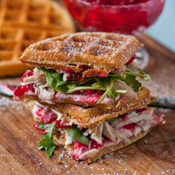 Still have Thanksgiving leftovers? Put that turkey and cranberry sauce to good use in these killer sweet and savory waffle sandwiches!