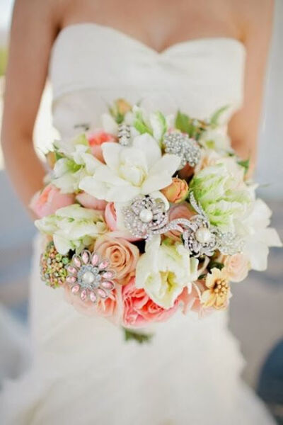 brooches &amp; flowers. possible D.I.Y idea to spice up a bouquet.