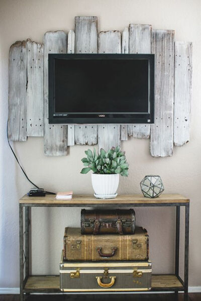 old wood behind the tv on the wall