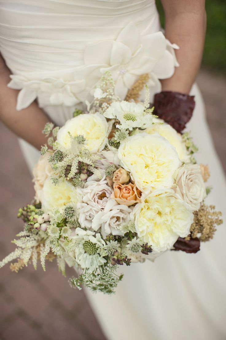 Polo roses, filler flowers, golden roses, dark red greenery soft pink spray roses, anemones, winter berry