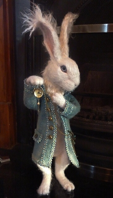 This is my version of Alice in wonderland's White Rabbit. He is needle felted with a Merino wool core and a mulberry silk overlay. I have made his coat by wet felting the wool and he holds a working pocket watch.