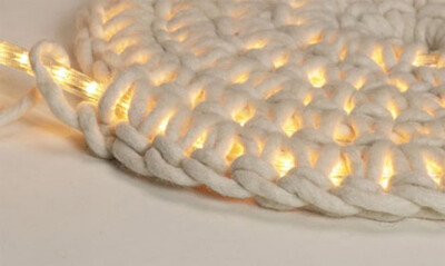 Love this.... Crocheting around rope light to make an outdoor floor mat.