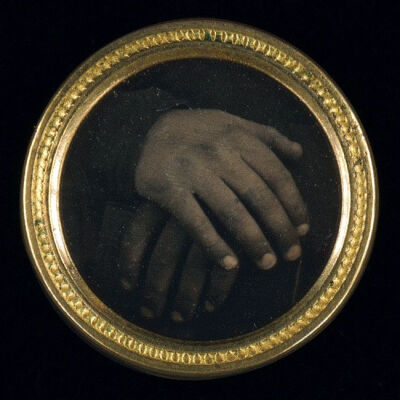 Daguerreotype button with an abolitionist motif may be one of the first political buttons made in America to incorporate a photograph. Believed to be unique, the miniature daguerreotype shows two hand…