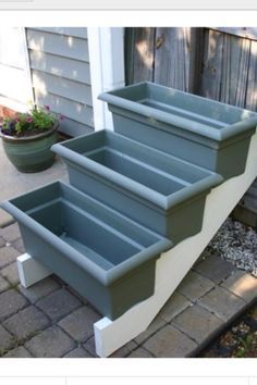 Purchase stair risers from your local home improvement store...paint it
white and add some window boxes... small herb garden?