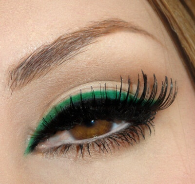 Double lined eye makeup in black and green